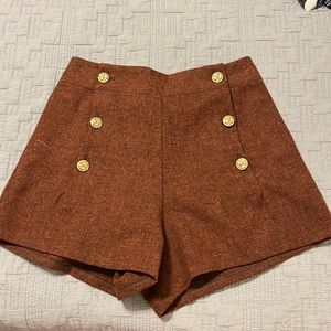 High waisted shorts, fits like a small. Burnt orange. ?wool